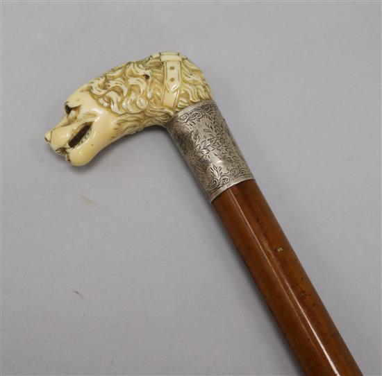 A good mid 19th century carved ivory handled cane, length 35.25in.